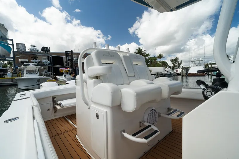 Slide: The Image of 2020 Regulator 31 boat interior with white seating at marina. - 51