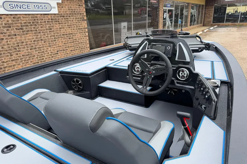 Slide: The Image of 2026 Xpress H18C Crappie boat interior with modern dashboard and seating. - 2