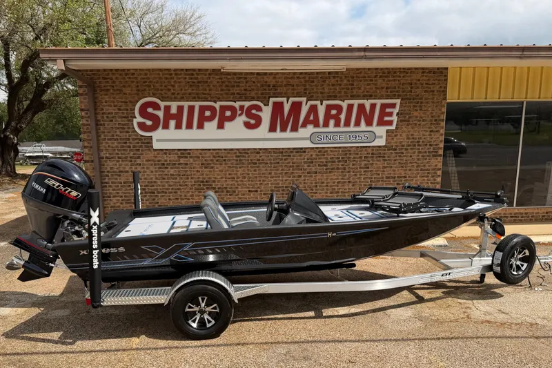 Slide: The Image of 2026 Xpress H18C Crappie boat on trailer at Shipp's Marine dealership. - 5