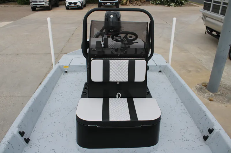 Slide: The Image of 2026 Freedom Boats 16' Eagle interior with steering console and seating. - 10