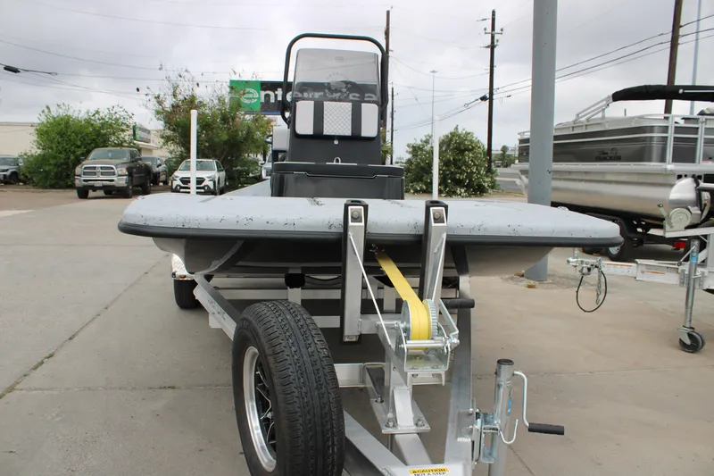 Slide: The Image of 2026 Freedom Boats 16' Eagle on trailer, parked outdoors, showcasing front view and winch. - 12