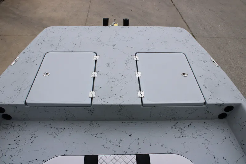 Slide: The Image of 2026 Freedom Boats 16' Eagle deck with dual storage hatches, featuring a sleek, marbled design. - 6