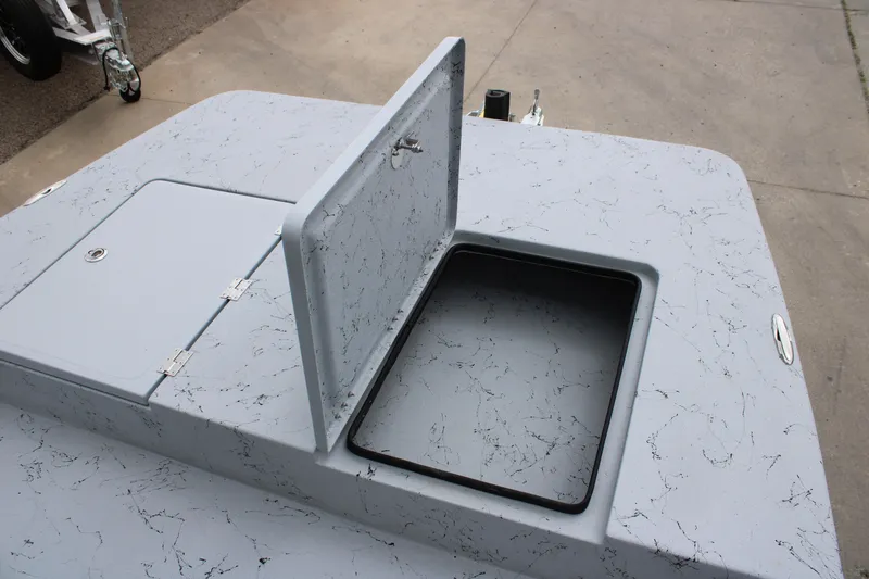 Slide: The Image of 2026 Freedom Boats 16' Eagle with open storage compartment on marbled deck. - 8