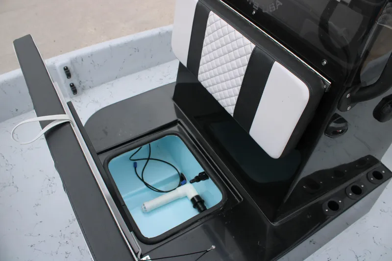 Slide: The Image of 2026 Freedom Boats 16' Eagle interior storage compartment with pump and seating. - 9