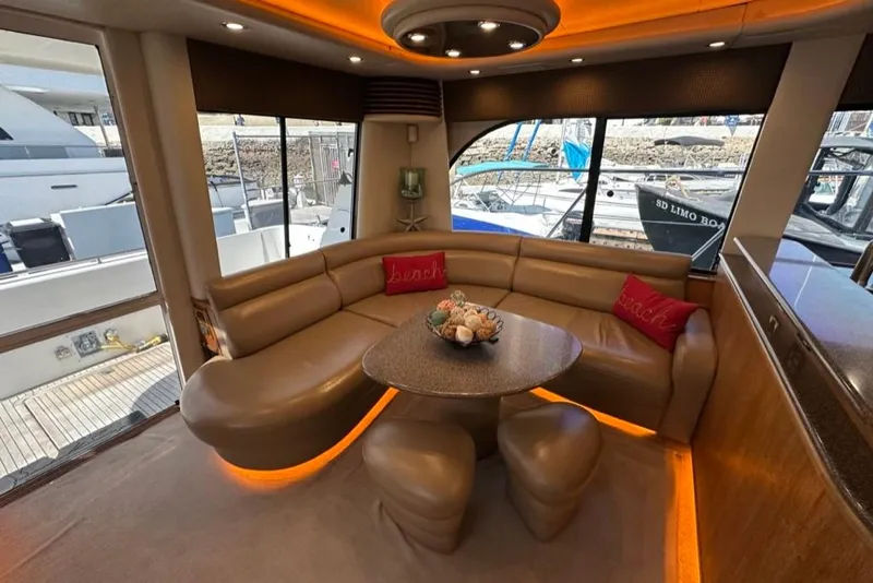 Slide: The Image of Luxurious interior of 1999 Bayliner 5788 Pilot House Motoryacht with elegant seating and decor. - 10