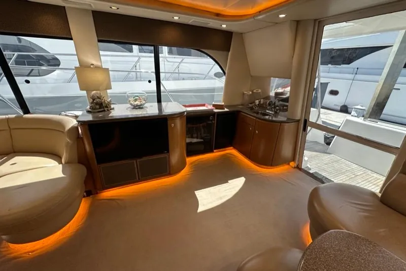 Slide: The Image of Luxurious interior of a 1999 Bayliner 5788 Pilot House Motoryacht with ambient lighting. - 13