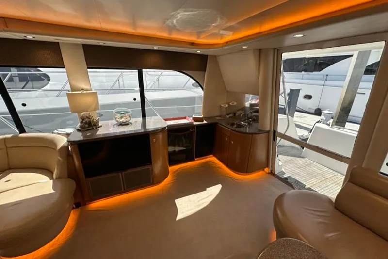 Slide: The Image of Luxurious interior of a 1999 Bayliner 5788 Pilot House Motoryacht with ambient lighting. - 14