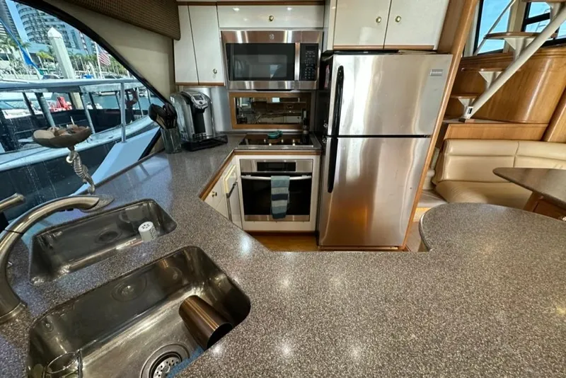 Slide: The Image of Luxurious kitchen in 1999 Bayliner 5788 Pilot House Motoryacht with modern appliances. - 21