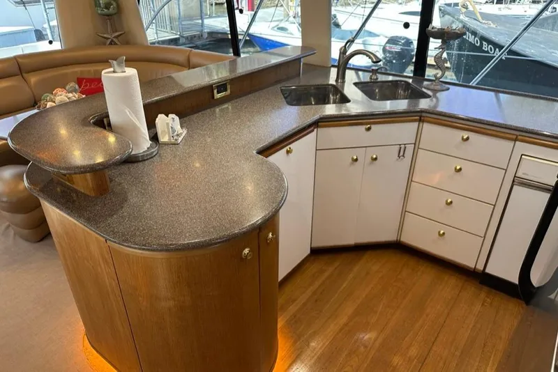 Slide: The Image of Luxurious kitchen interior of 1999 Bayliner 5788 Pilot House Motoryacht with modern amenities. - 24