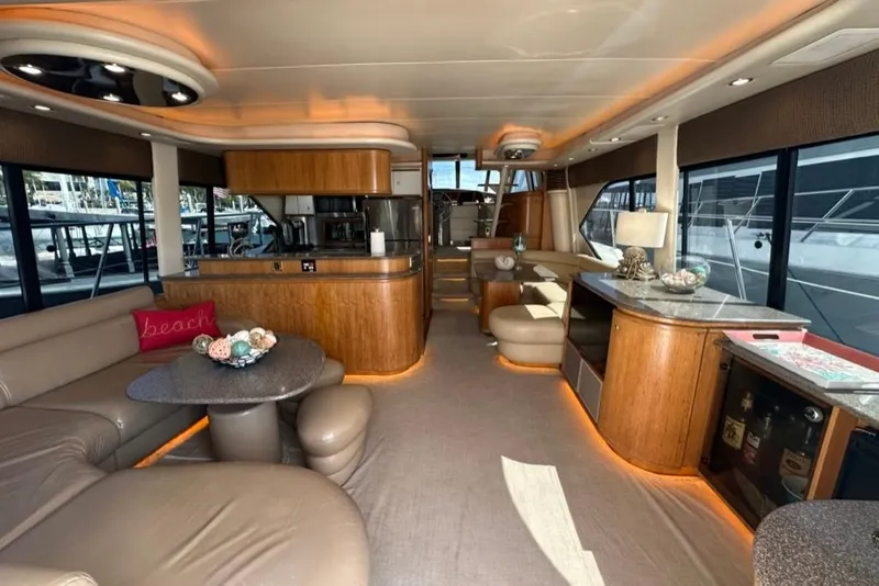 Slide: The Image of Luxurious interior of a 1999 Bayliner 5788 Pilot House Motoryacht with elegant furnishings. - 4