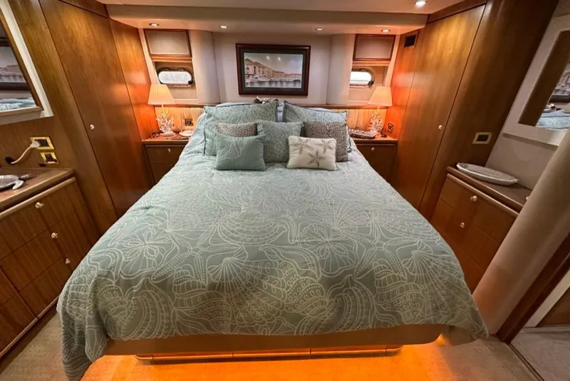 Slide: The Image of Luxurious bedroom interior of 1999 Bayliner 5788 Pilot House Motoryacht with elegant bedding. - 40