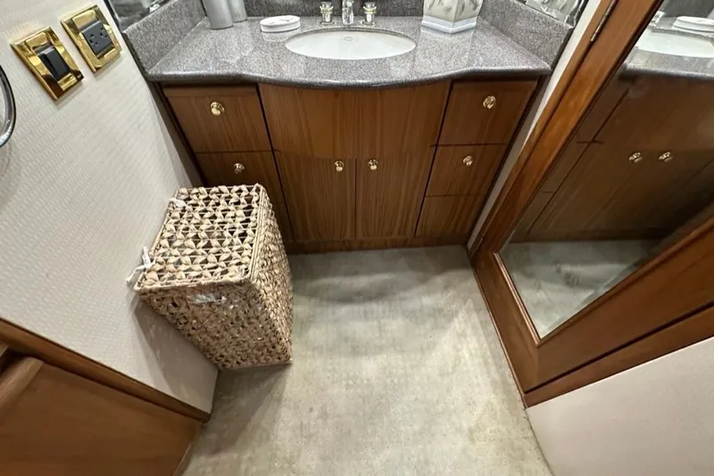 Slide: The Image of Luxurious bathroom interior of 1999 Bayliner 5788 Pilot House Motoryacht with wooden cabinetry. - 42