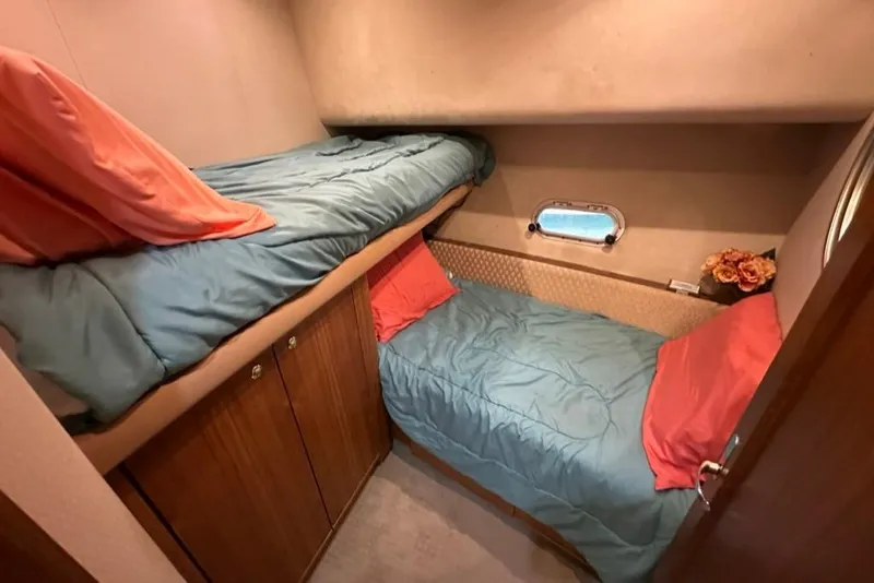 Slide: The Image of Cozy cabin with bunk beds in 1999 Bayliner 5788 Pilot House Motoryacht. - 43