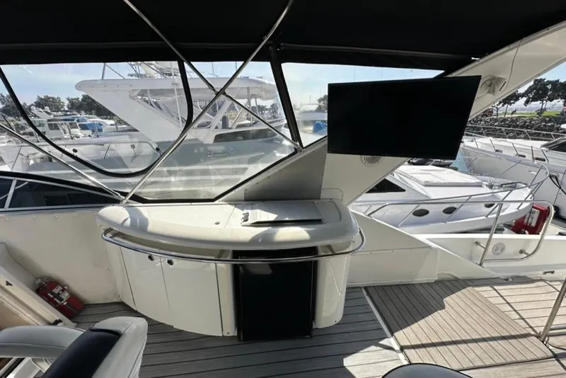 Slide: The Image of 1999 Bayliner 5788 Pilot House Motoryacht interior with modern helm and marina view. - 47