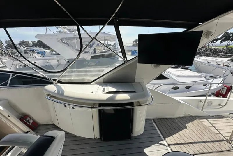 Slide: The Image of 1999 Bayliner 5788 Pilot House Motoryacht interior with modern helm and large windows. - 48