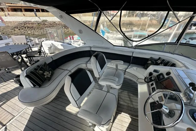 Slide: The Image of 1999 Bayliner 5788 Pilot House Motoryacht interior with seating and helm station. - 50