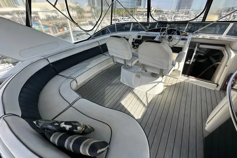 Slide: The Image of 1999 Bayliner 5788 Pilot House Motoryacht interior with seating and helm, featuring modern design. - 51