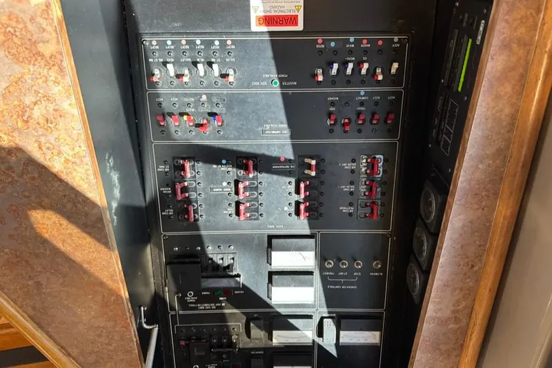 Slide: The Image of Electrical panel of a 1999 Bayliner 5788 Pilot House Motoryacht with switches and controls. - 59