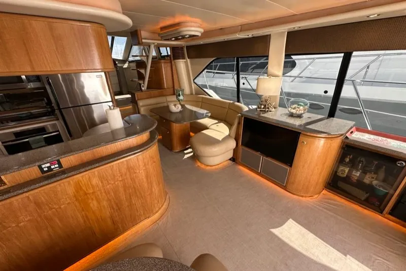 Slide: The Image of Luxurious interior of a 1999 Bayliner 5788 Pilot House Motoryacht with modern amenities. - 6