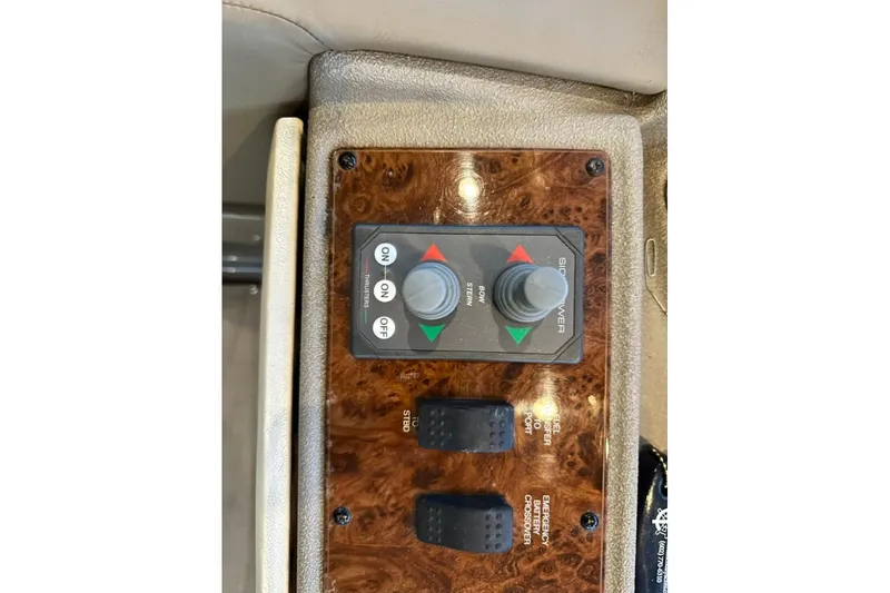 Slide: The Image of Control panel of a 1999 Bayliner 5788 Pilot House Motoryacht with joystick and switches. - 62