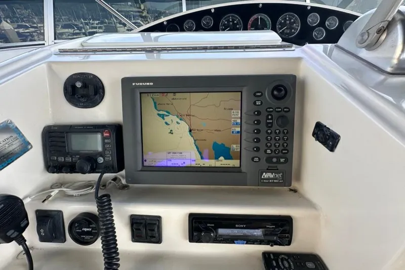 Slide: The Image of Navigation system and controls on a 1999 Bayliner 5788 Pilot House Motoryacht. - 65