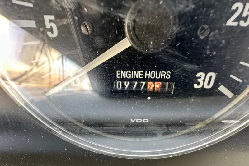 Slide: The Image of Close-up of 1999 Bayliner 5788 Pilot House Motoryacht engine hours gauge showing 977.5 hours. - 73