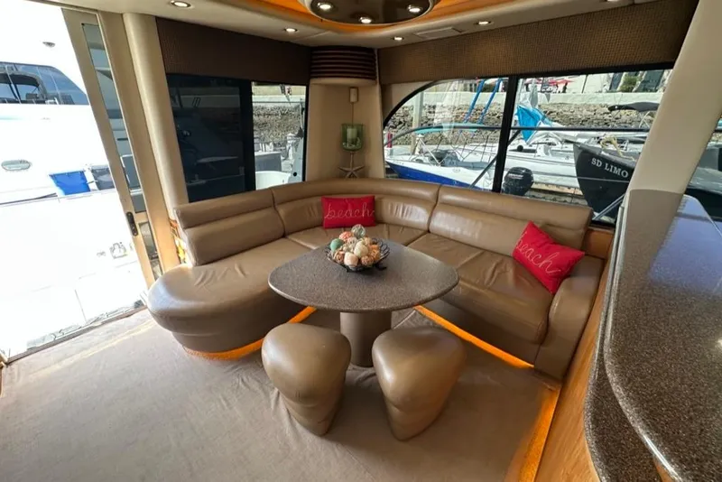 Slide: The Image of Luxurious interior of 1999 Bayliner 5788 Pilot House Motoryacht with leather seating and modern decor. - 9