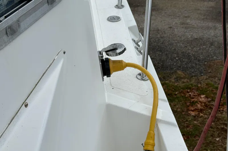 Slide: The Image of Yellow power cable connected to a 2005 Osprey 28 Long Cabin boat. - 7