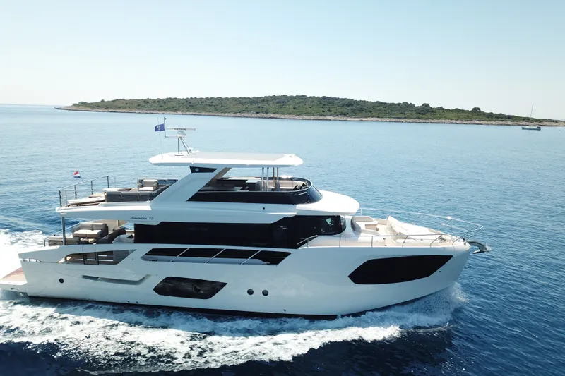 The Image of Luxury Absolute Navetta 70 yacht cruising in serene blue waters, 2026 model. - 0