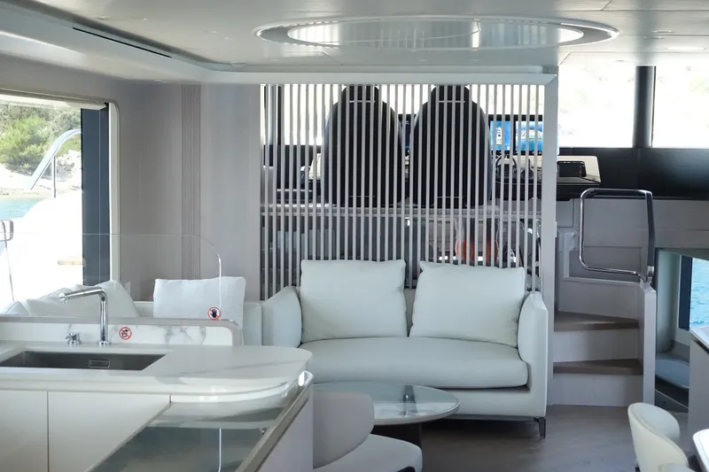 Slide: The Image of Luxurious interior of 2026 Absolute Navetta 70 yacht with modern seating and helm station. - 19