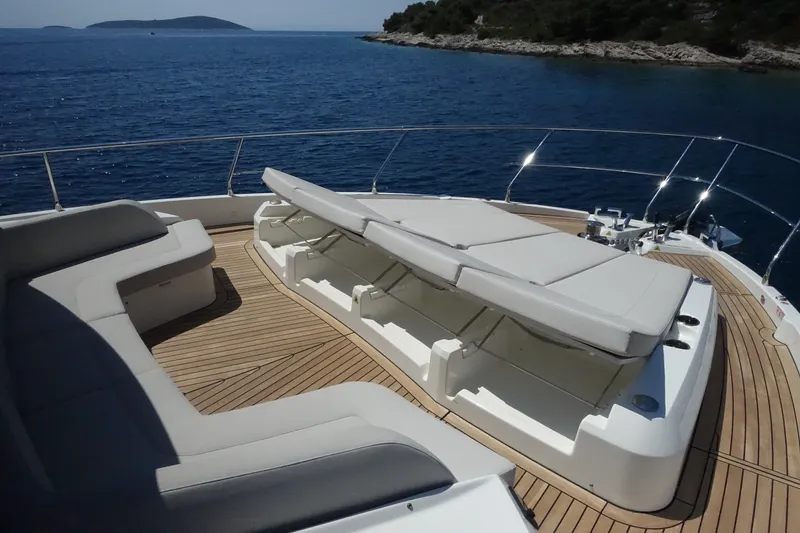 Slide: The Image of Luxurious deck of 2026 Absolute Navetta 70 yacht with sun loungers and ocean view. - 20