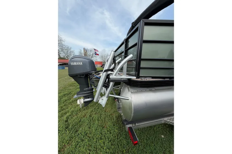 Slide: The Image of 2026 Veranda Vista 18VF4 pontoon boat with Yamaha outboard motor on grassy area. - 3