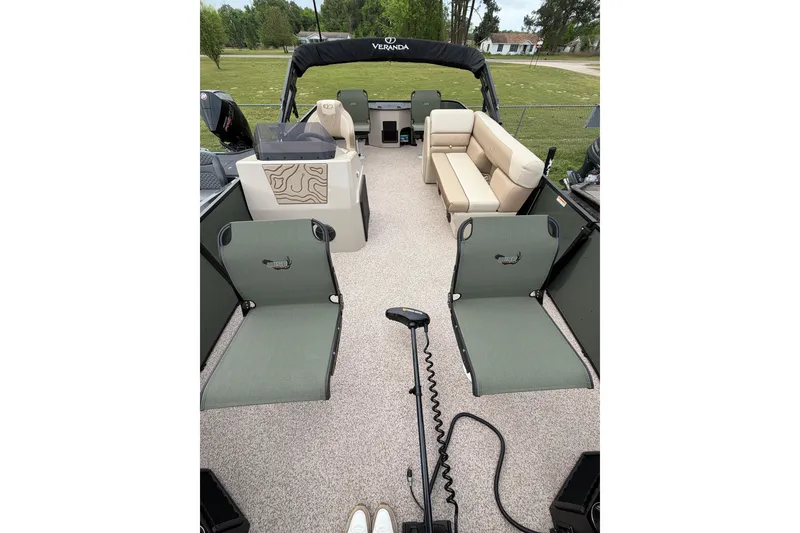 Slide: The Image of 2026 Veranda Vista 18VF4 pontoon boat interior with seating and control console. - 6