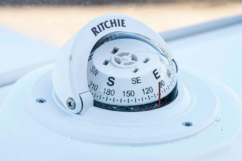 Slide: The Image of Compass on 2026 Tidewater 2110 Bay Max boat dashboard, showing southeast direction. - 11