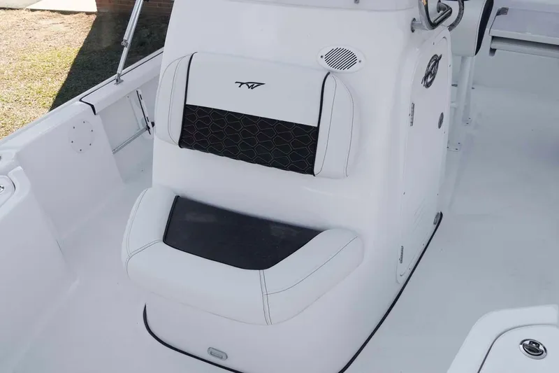 Slide: The Image of 2026 Tidewater 2110 Bay Max boat interior with cushioned seating and sleek design. - 16