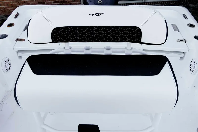 Slide: The Image of 2026 Tidewater 2110 Bay Max boat interior with sleek white and black seating design. - 17