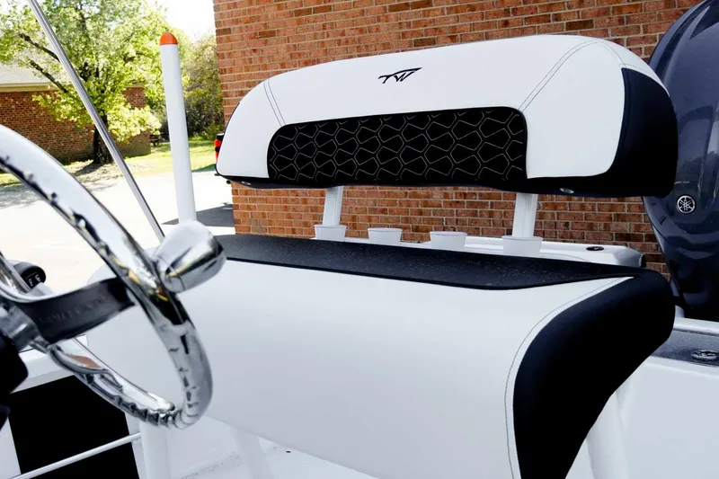 Slide: The Image of 2026 Tidewater 2110 Bay Max boat interior with sleek seating and steering wheel. - 18