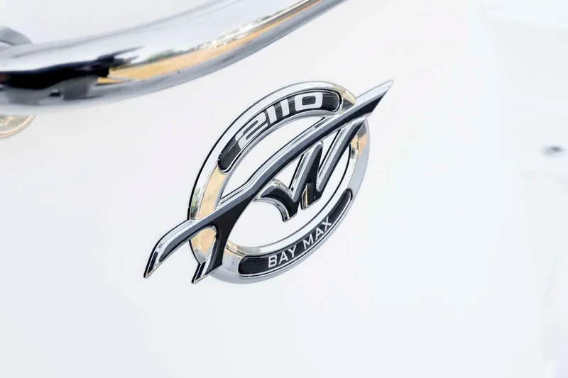 Slide: The Image of Chrome emblem of the 2026 Tidewater 2110 Bay Max boat. - 23