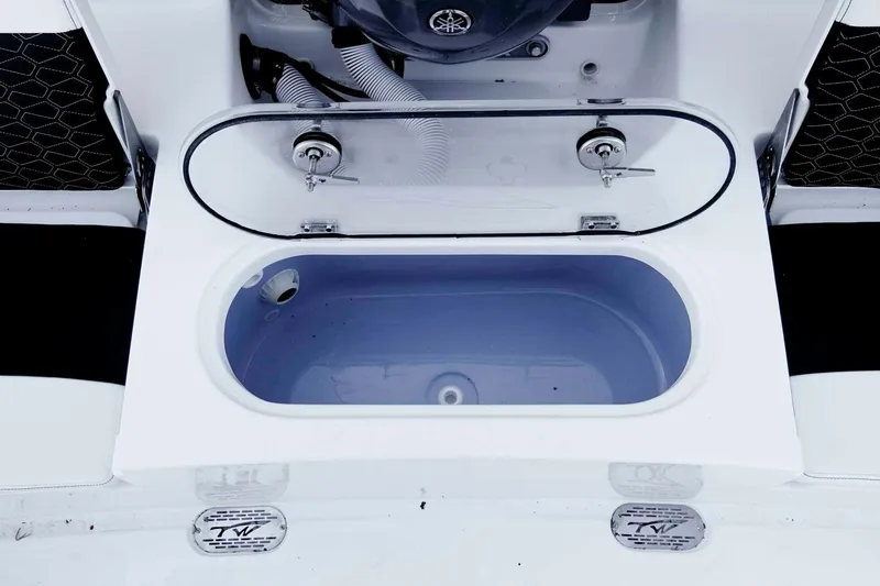 Slide: The Image of Livewell compartment on a 2026 Tidewater 2110 Bay Max boat, open and empty. - 24