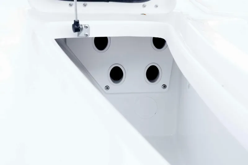 Slide: The Image of 2026 Tidewater 2110 Bay Max boat interior detail with multiple circular openings. - 27