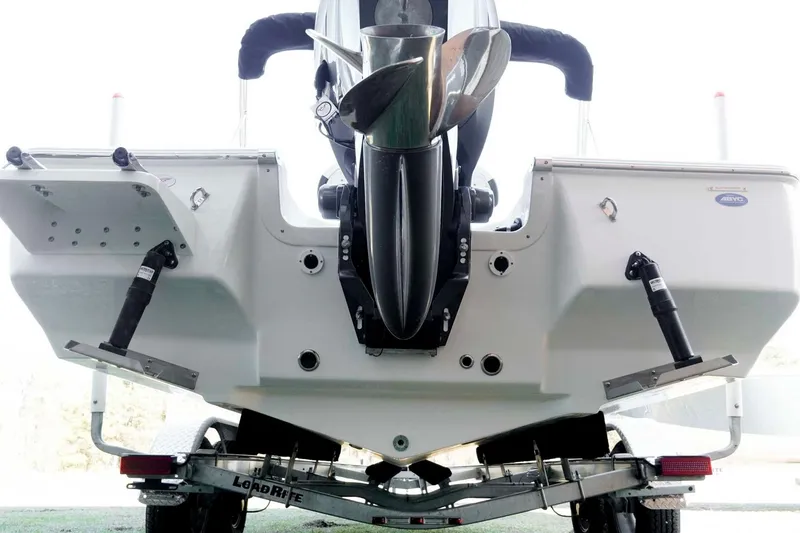 Slide: The Image of 2026 Tidewater 2110 Bay Max boat rear view with motor and trailer. - 34