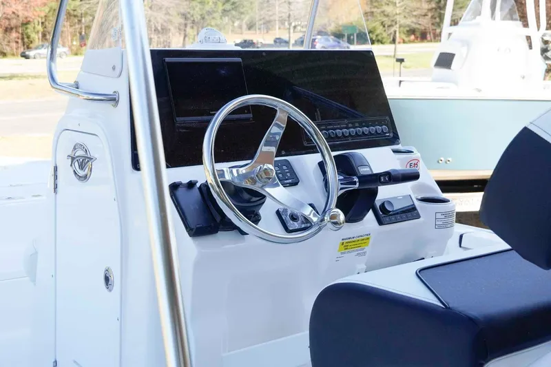 Slide: The Image of 2026 Tidewater 2110 Bay Max boat console with steering wheel and controls. - 4