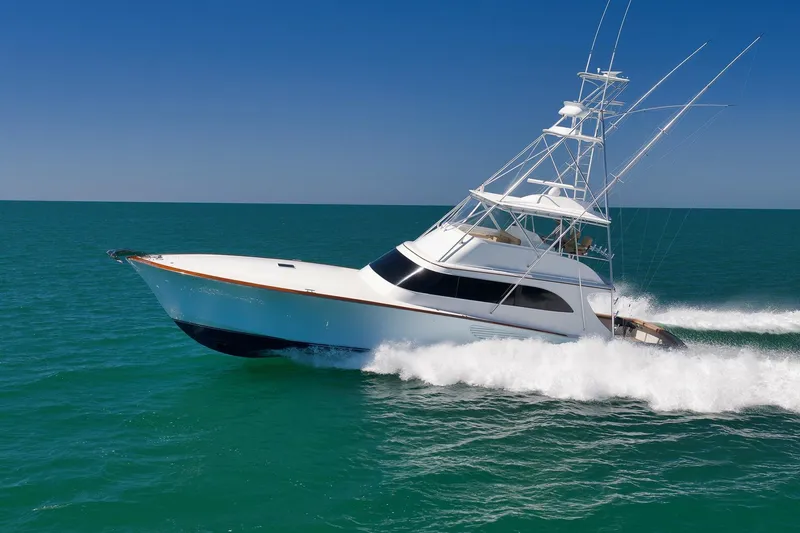 Slide: The Image of 2003 Weaver Custom Sportfish yacht cruising swiftly on open ocean waters. - 10