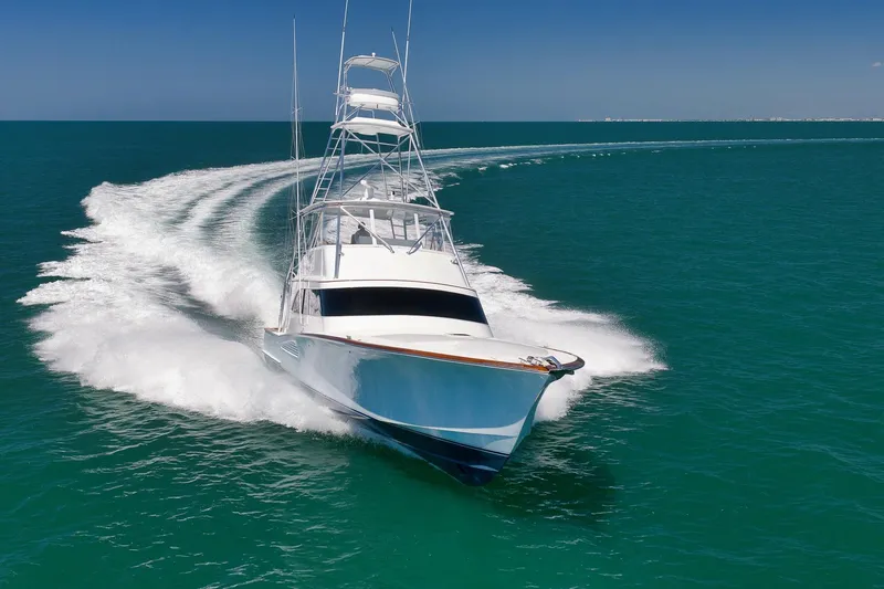 Slide: The Image of 2003 Weaver Custom Sportfish yacht cruising swiftly on open ocean waters. - 12