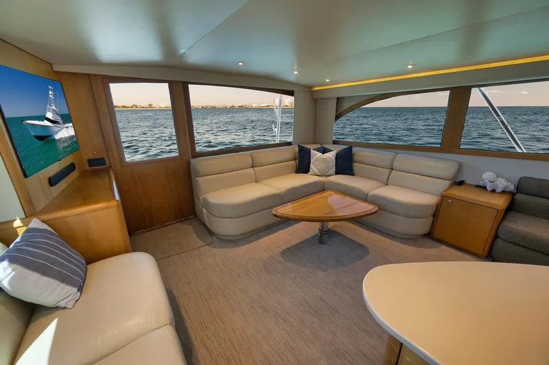 Slide: The Image of Luxurious interior of a 2003 Weaver Custom Sportfish yacht with ocean view and plush seating. - 15