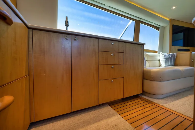 Slide: The Image of Luxurious interior of 2003 Weaver Custom Sportfish yacht with wooden cabinetry and plush seating. - 20