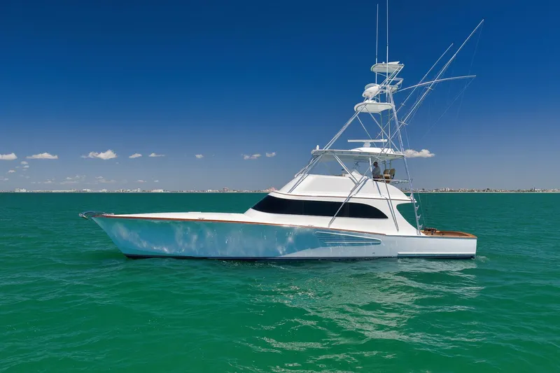Slide: The Image of 2003 Weaver Custom Sportfish yacht on turquoise ocean under clear blue sky. - 3