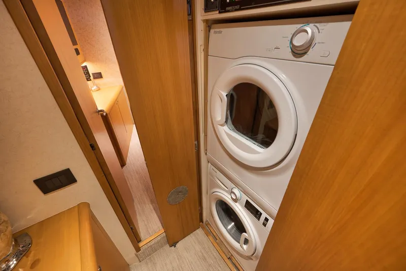 Slide: The Image of Stacked washer and dryer in 2003 Weaver Custom Sportfish yacht interior. - 32