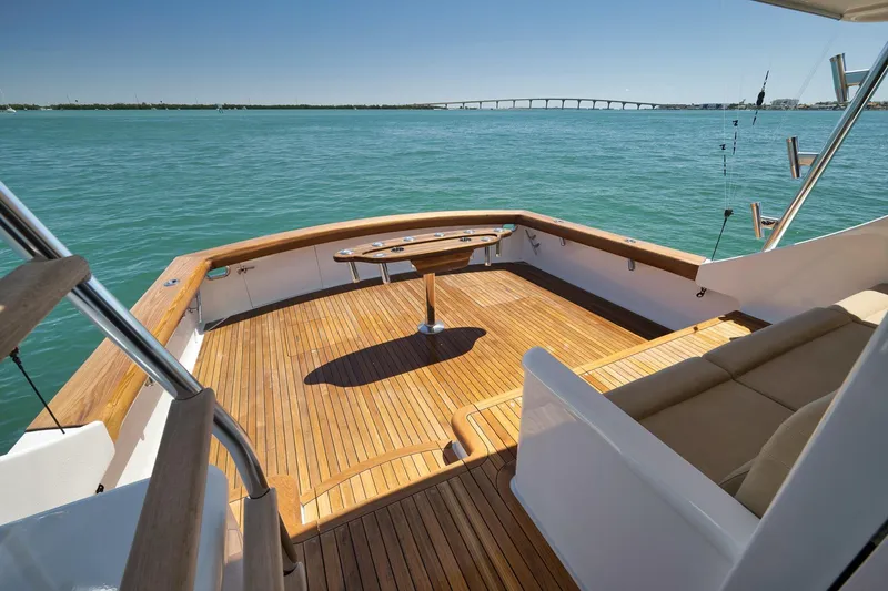 Slide: The Image of Luxurious 2003 Weaver Custom Sportfish yacht deck with wooden flooring and scenic ocean view. - 34
