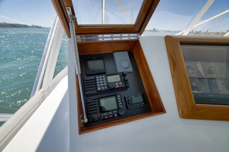 Slide: The Image of Control panel of a 2003 Weaver Custom Sportfish boat with navigation equipment. - 44